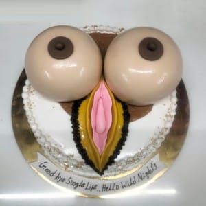 Funny adult bachelor party cake featuring 3D breast and vulva fondant design. Naughty custom cake for grooms available in Hyderabad, Banjara Hills, and Jubilee Hills.
