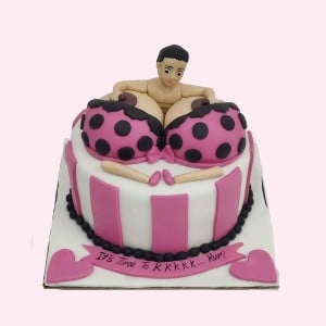 Funny bachelor party cake featuring 3D man and pink polka dot bikini boobs. Naughty custom cake delivery in Hyderabad, Banjara Hills, and Jubilee Hills.