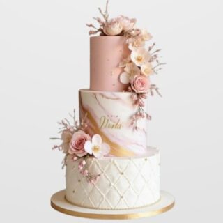 3-tier pink and marble engagement cake with gold accents and cascading sugar flowers. Luxury custom wedding cake delivery in Hyderabad, Banjara Hills, and Jubilee Hills.