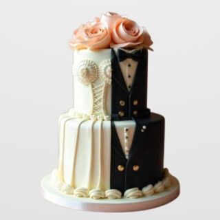 2-tier engagement cake split into black tuxedo and white wedding dress design with peach roses. Unique custom couple cake delivery in Hyderabad, Banjara Hills, and Jubilee Hills